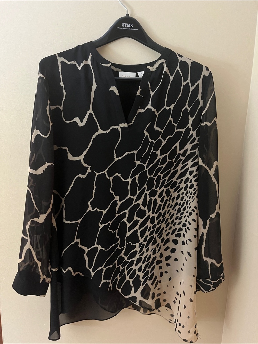 Chico’s floaty, black and cream top with a small V neck line